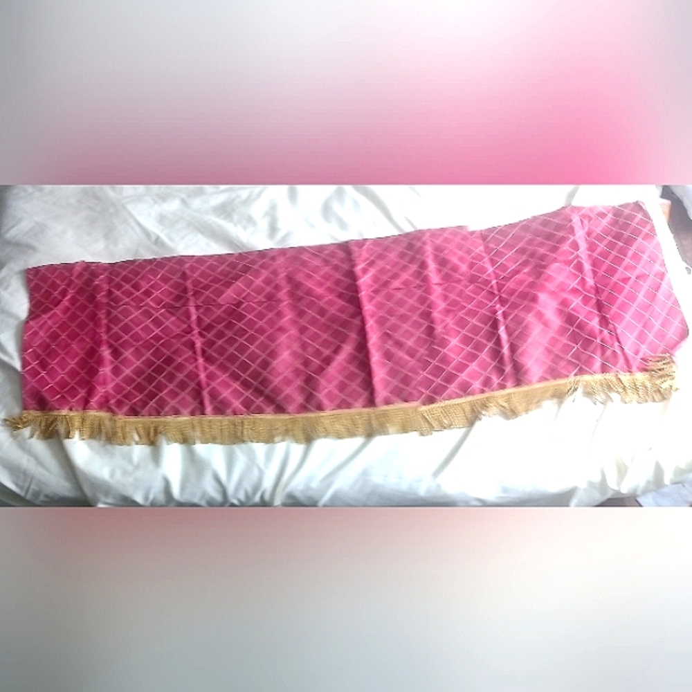 Red and gold curtain with tassels